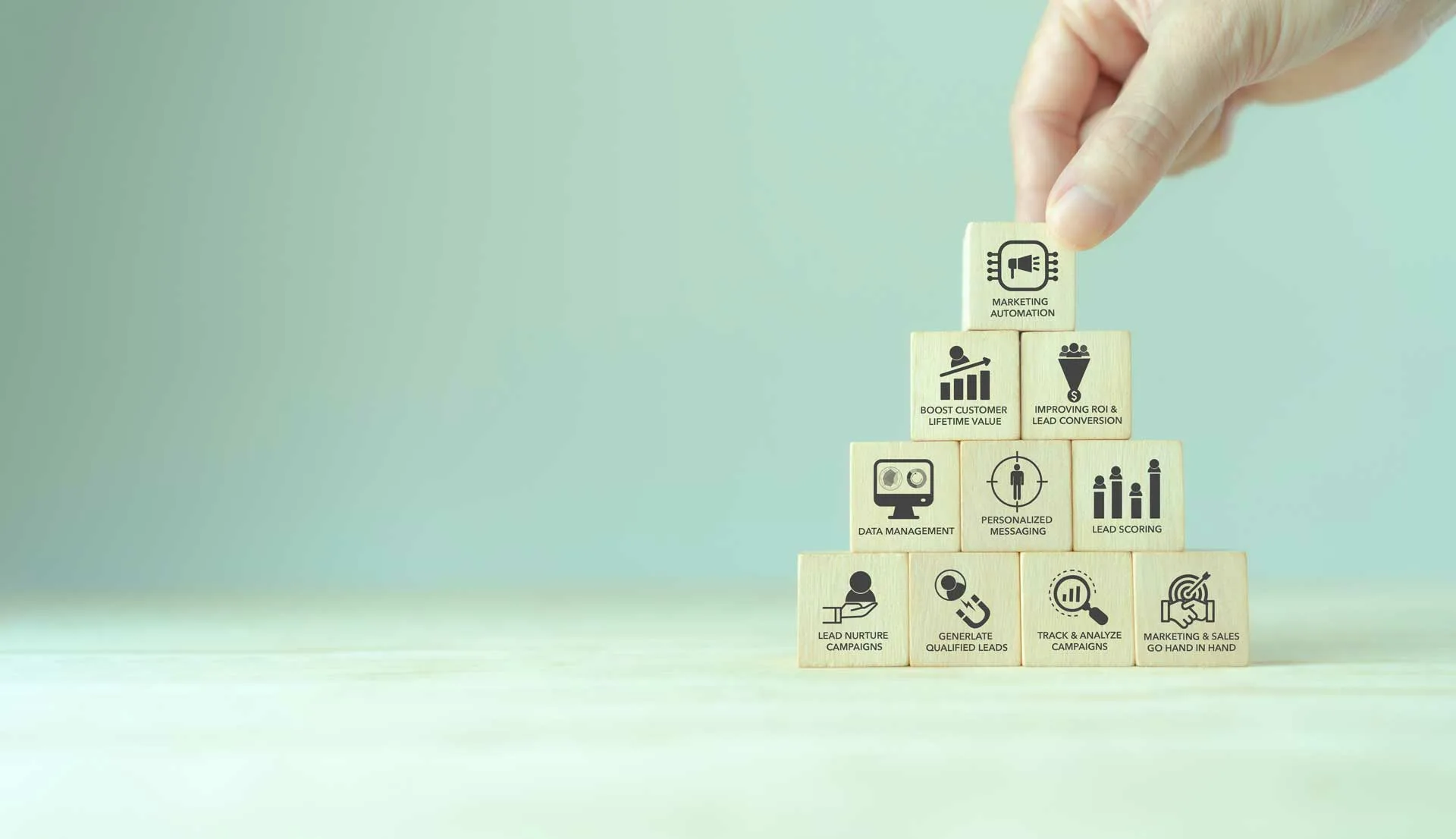 Stacked blocks featuring marketing process steps written on them