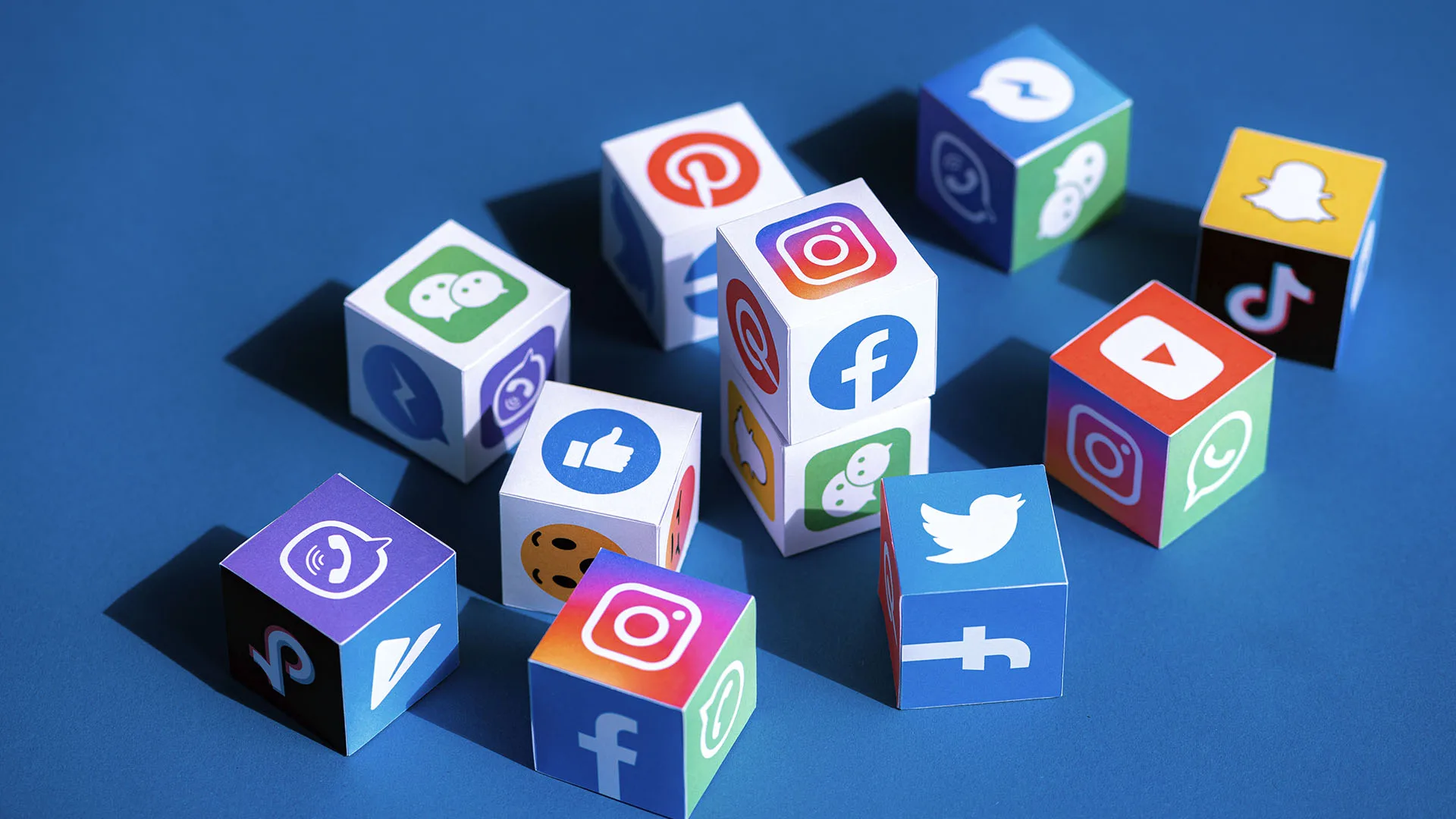 Scattered dice with social media icons on them