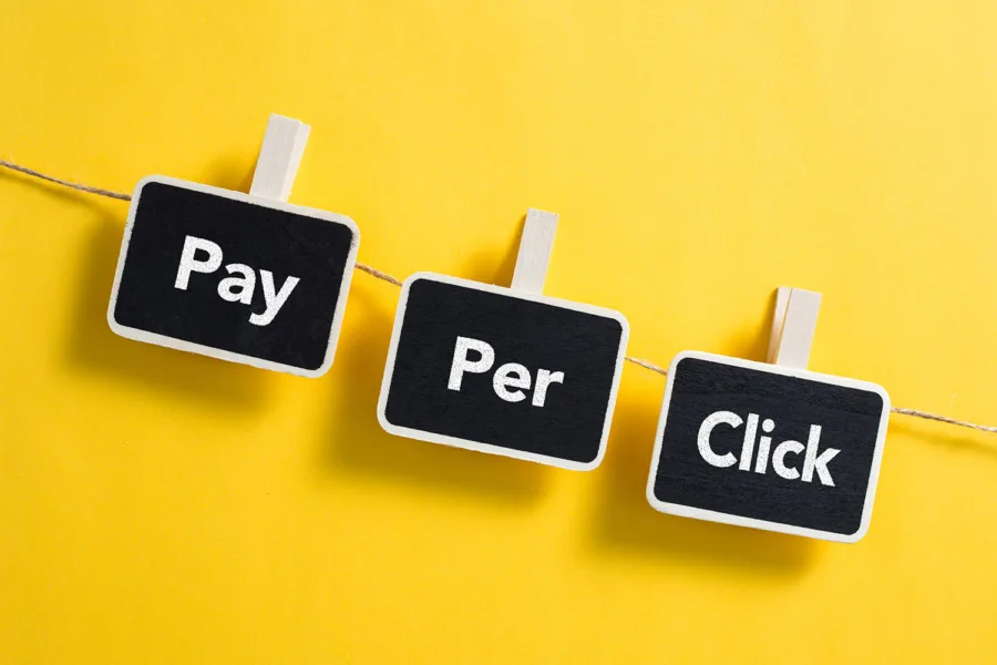 Three black block hanging form a string with the words Pay Per Click
