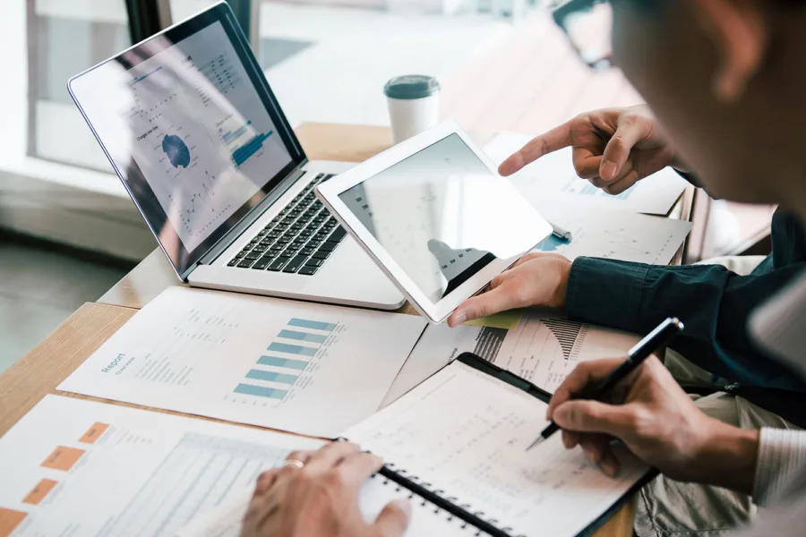 business people reviewing growth charts