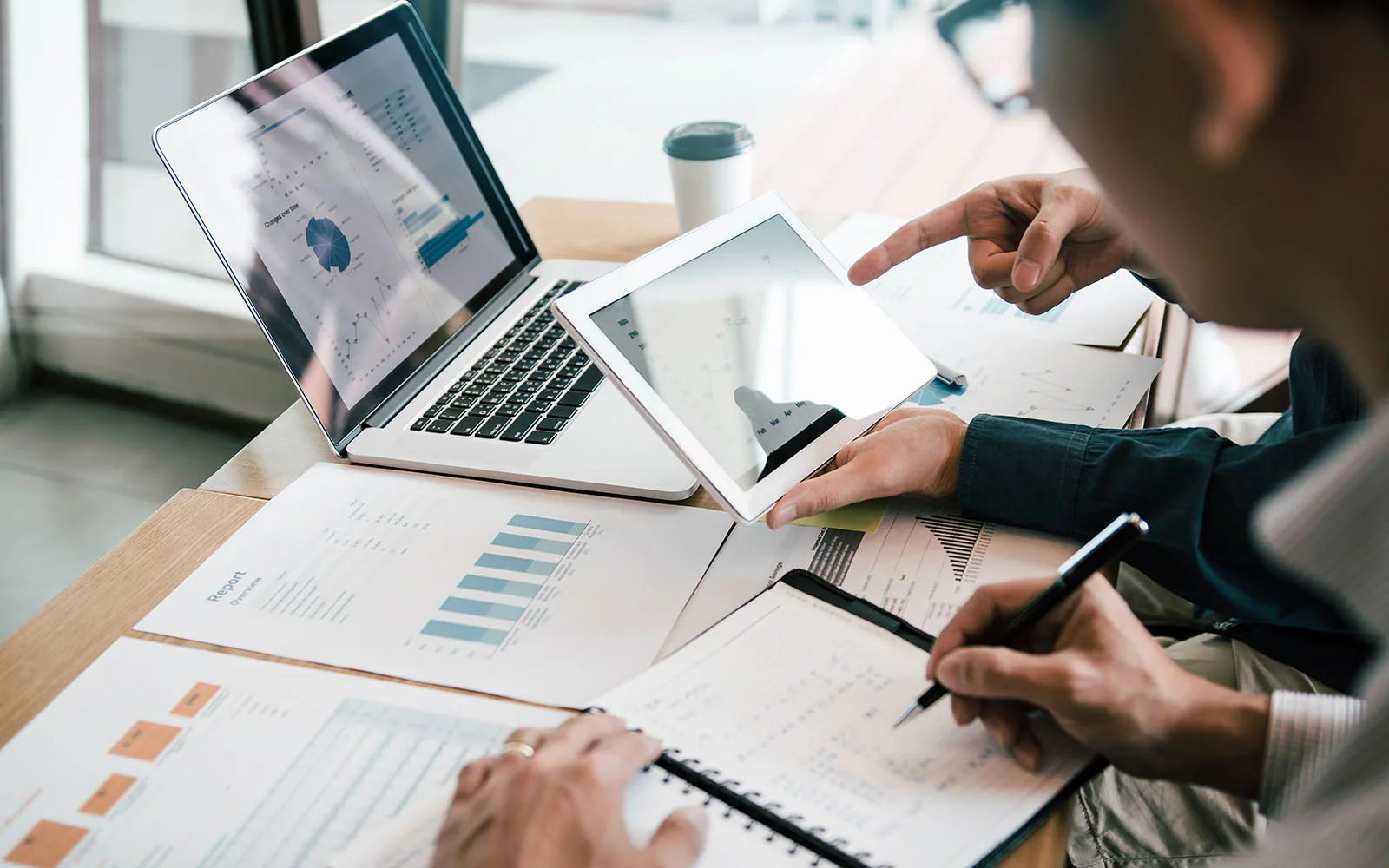 business people reviewing growth charts