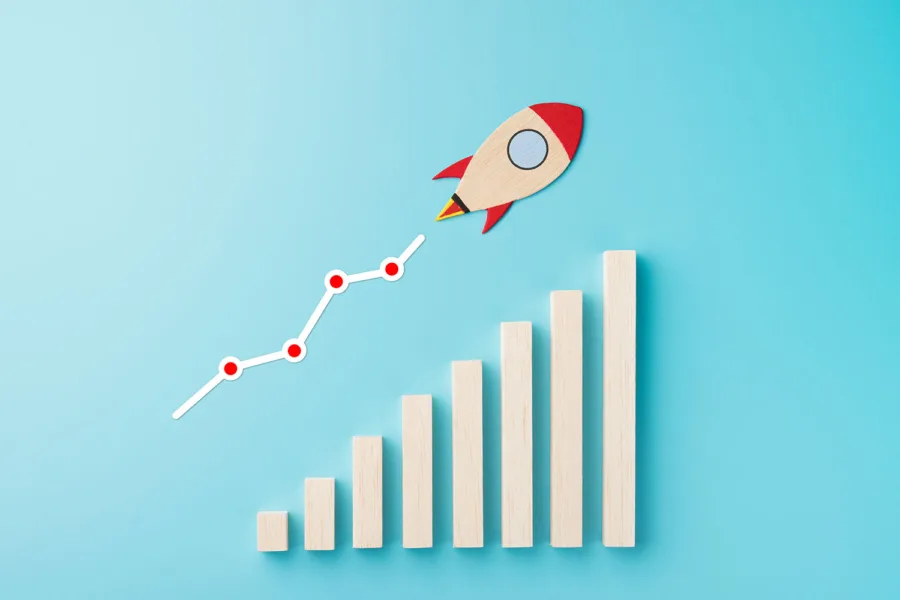 a wooden rocket piece shown zooming upward over a graph