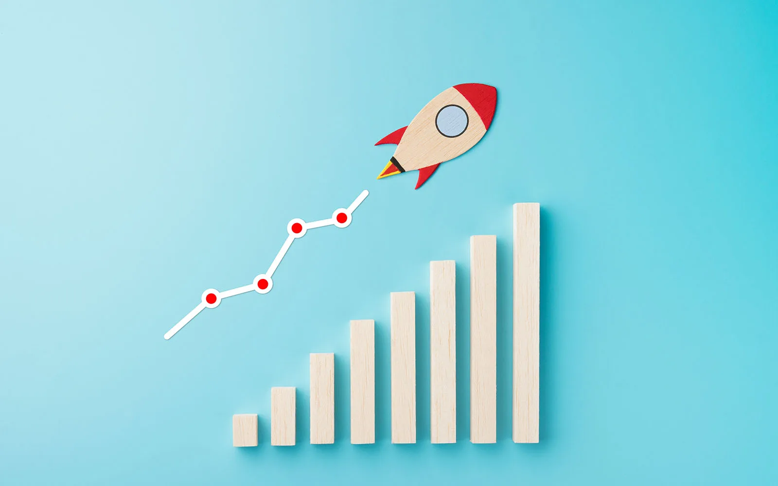 a wooden rocket piece shown zooming upward over a graph