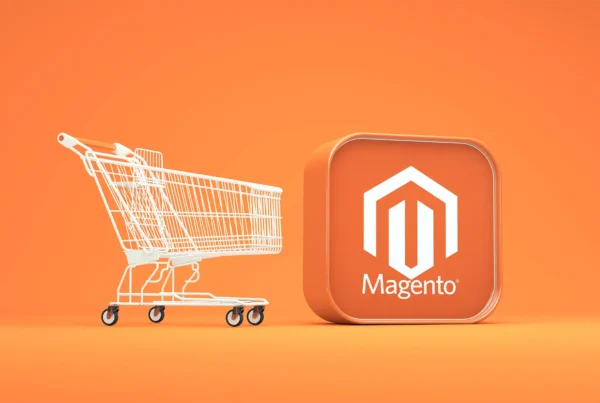 A shopping cart next to a Magento Logo on an orange background