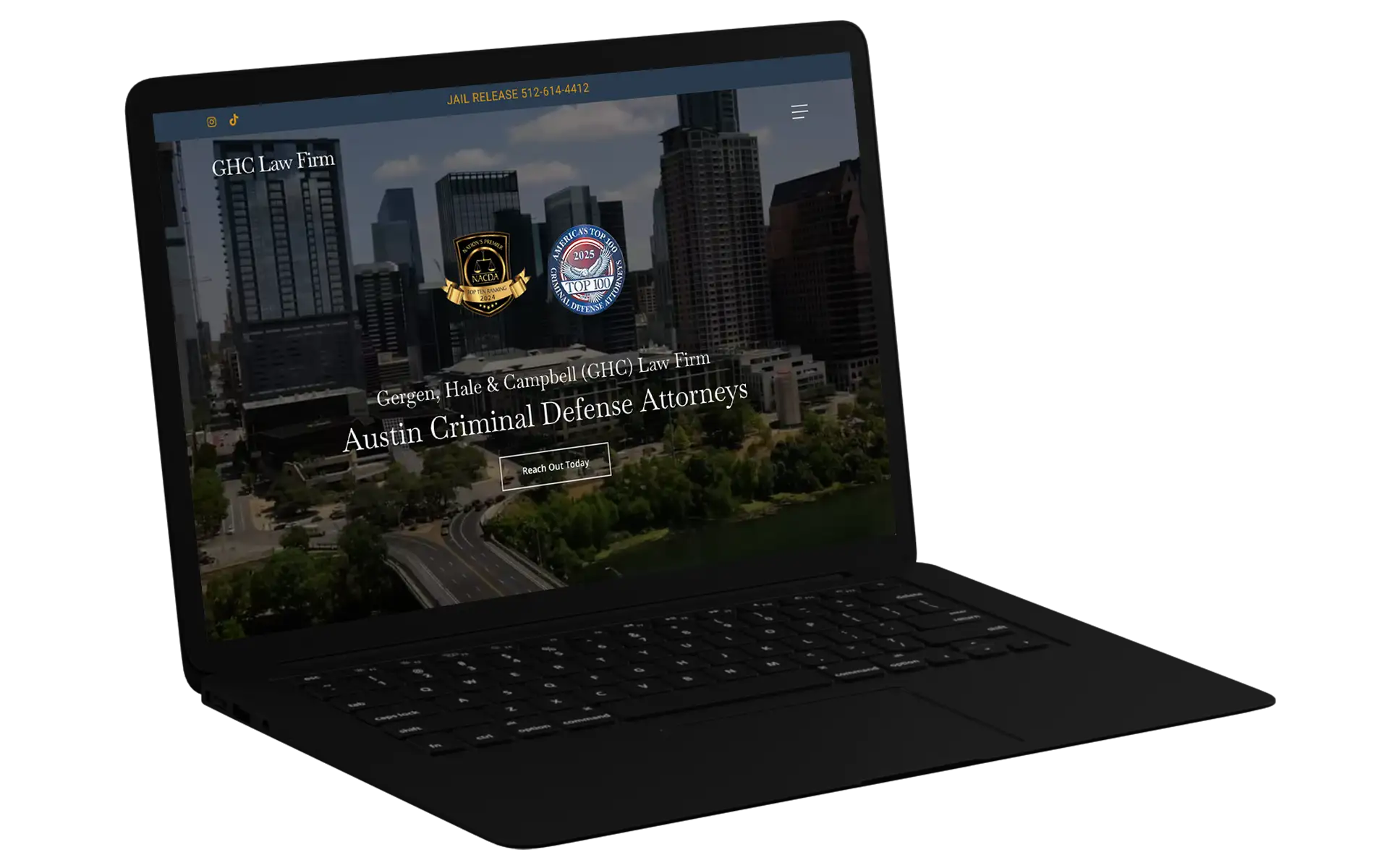 A black laptop showing the homepage display for a law firm's website