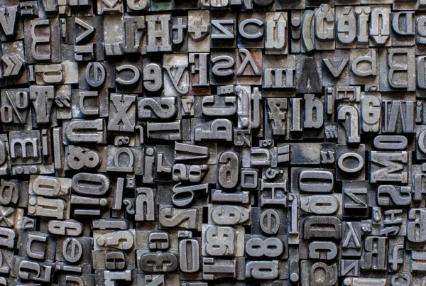 Various metal letters crowded together to create a background