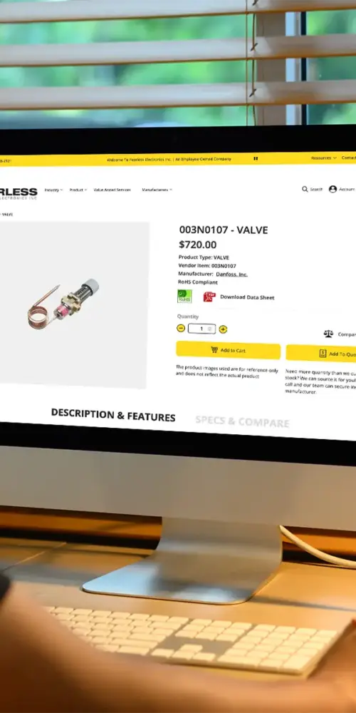 An engineer using a computer to research component solutions on a Magento-built website, the best ecommerce platform for electronics