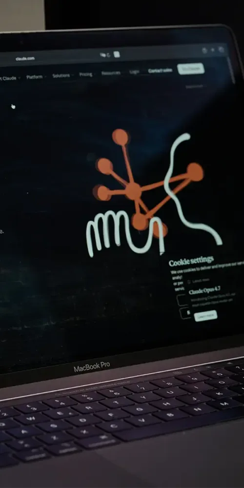 A laptop screen displaying the Claude website homepage.