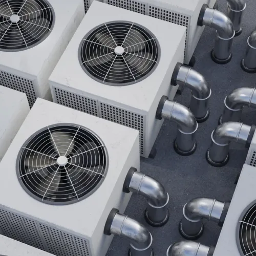 An aerial view of multiple HVACs on a rooftop.