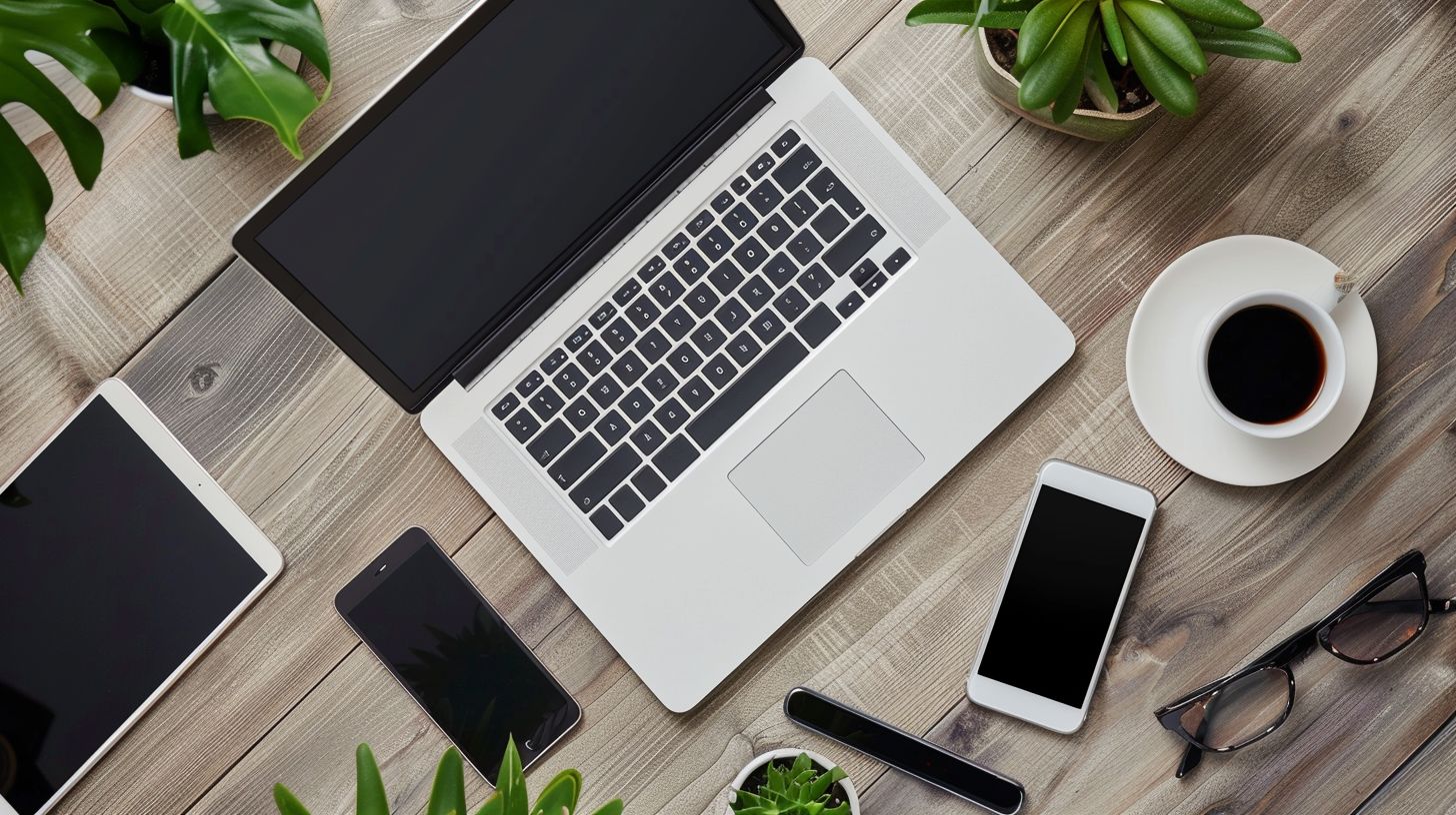 A modern desk with electronic devices captured from above.